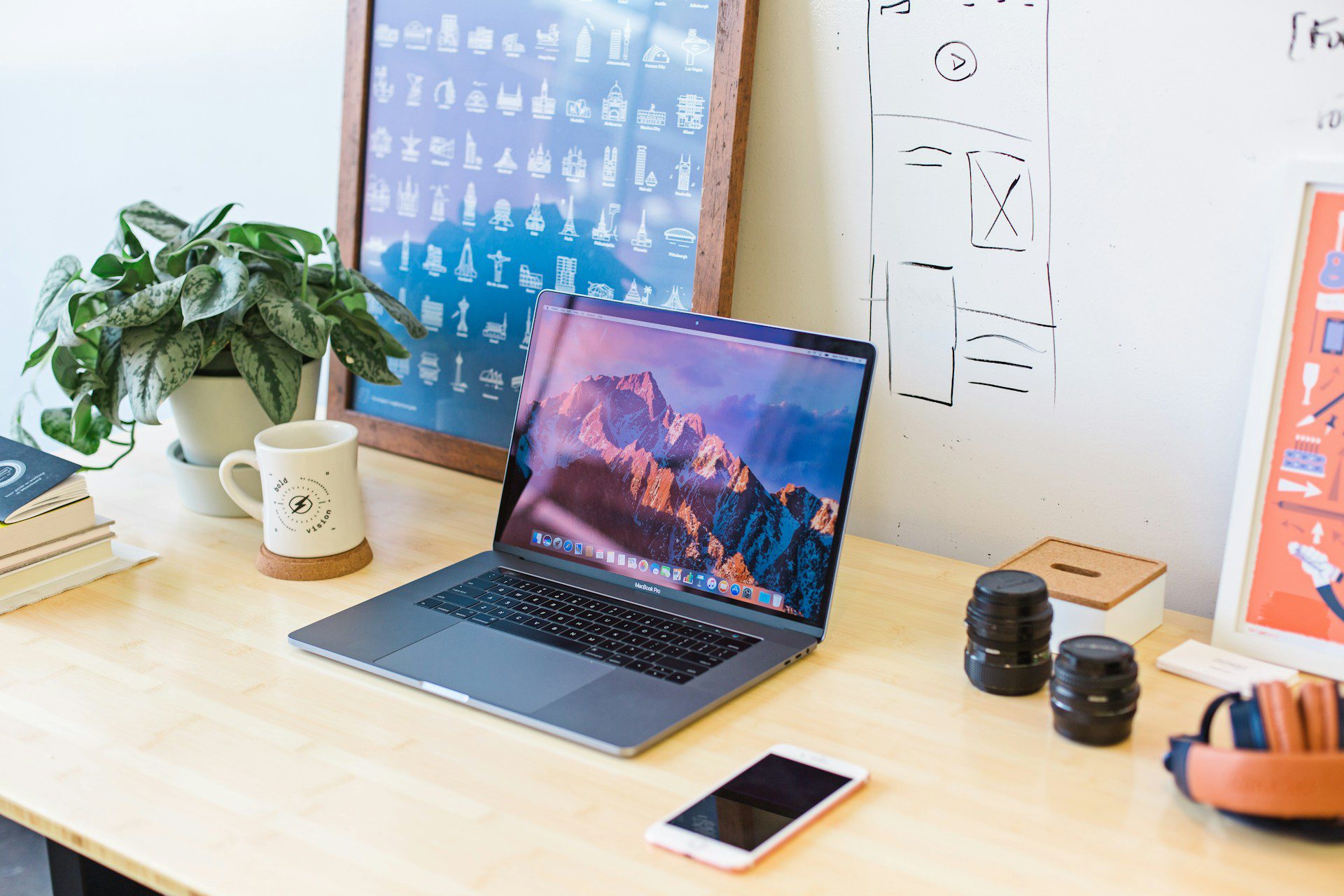 A laptop and a phone on a table
