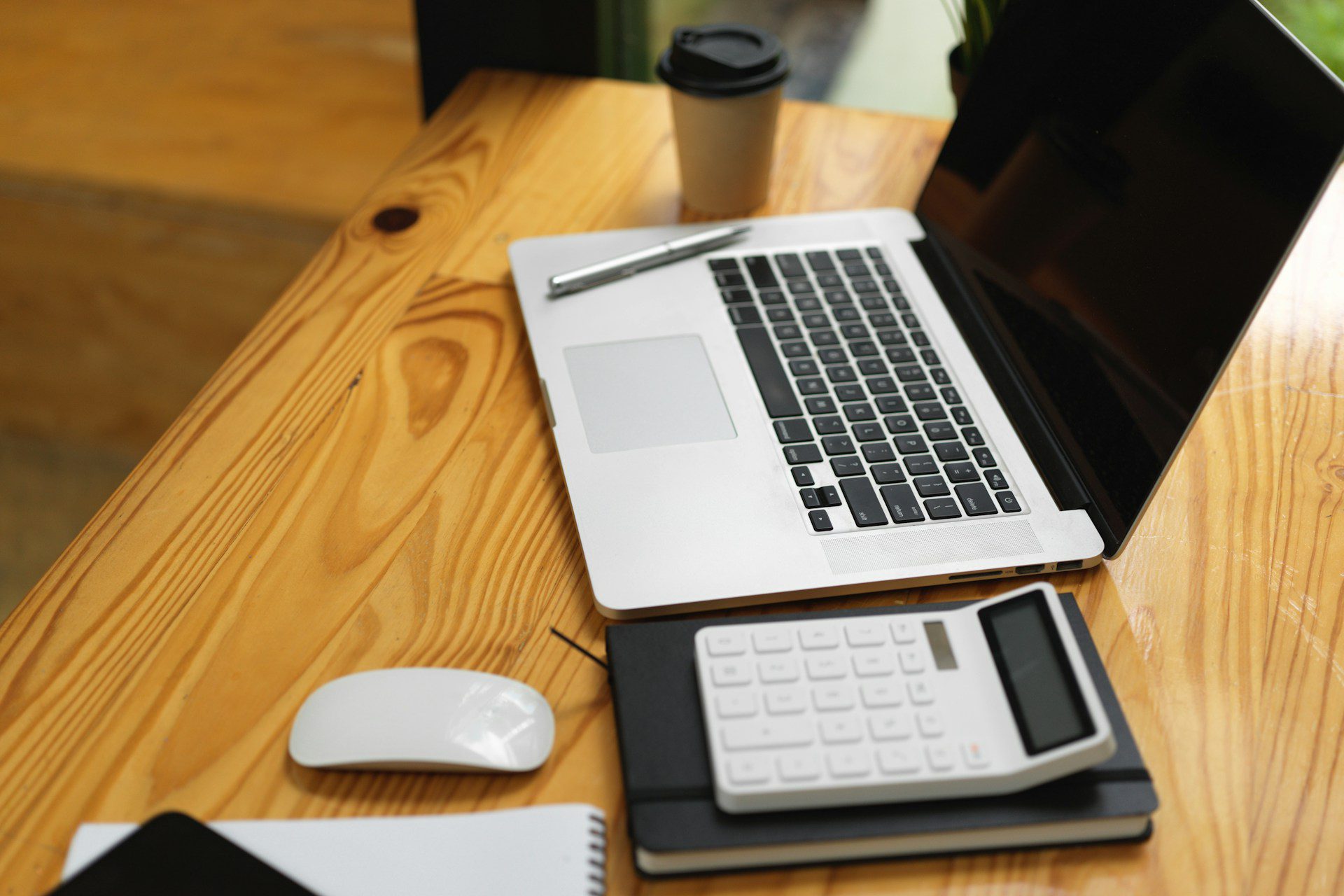 A laptop and a calculator on a table