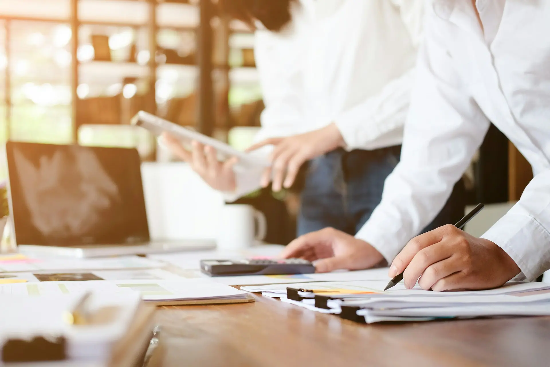 A person writing on a paper